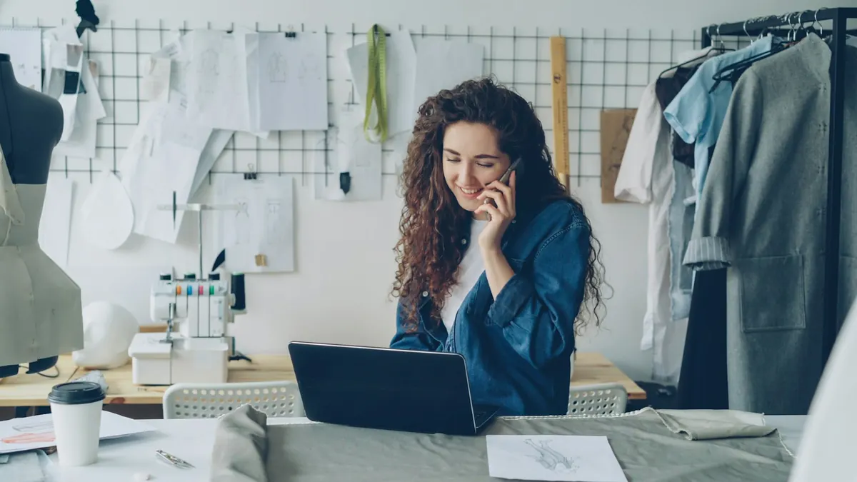 A consultant on the phone at her computer