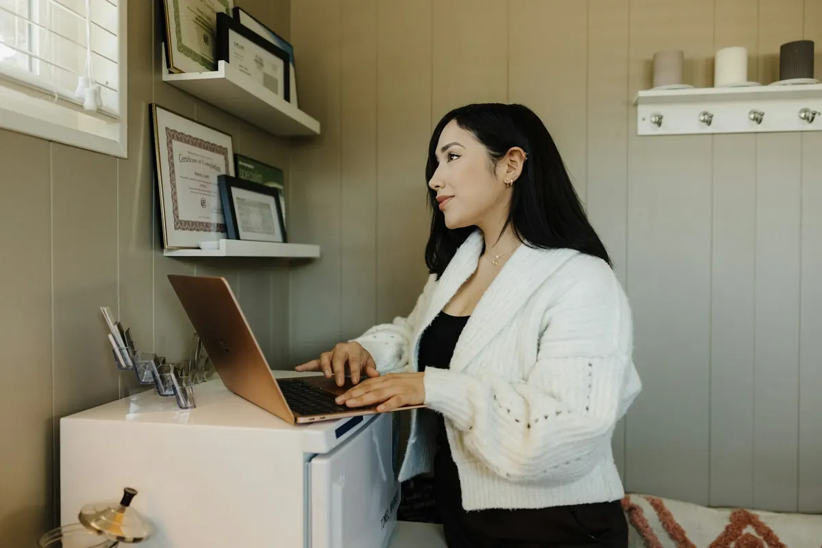 A professional managing her appointments on her computer